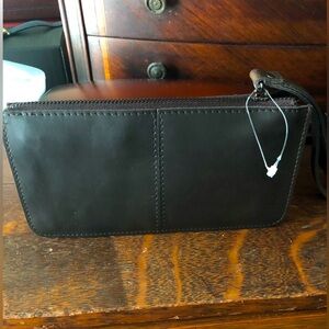 Leather wristlet wallet, deep rich brown color bought at tannery in Texas.